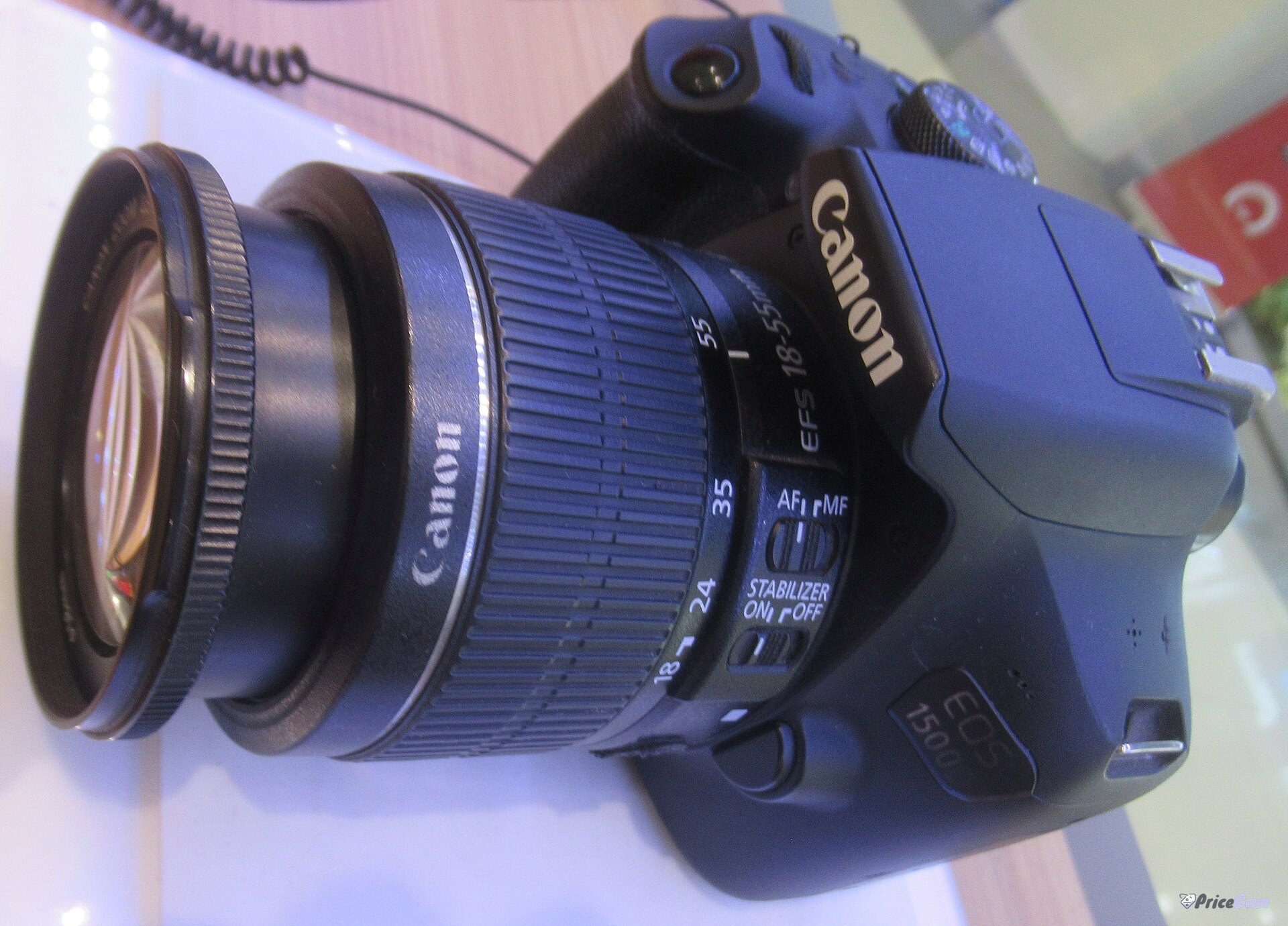 Canon 1500D price in Pakistan, DSLR camera body front view