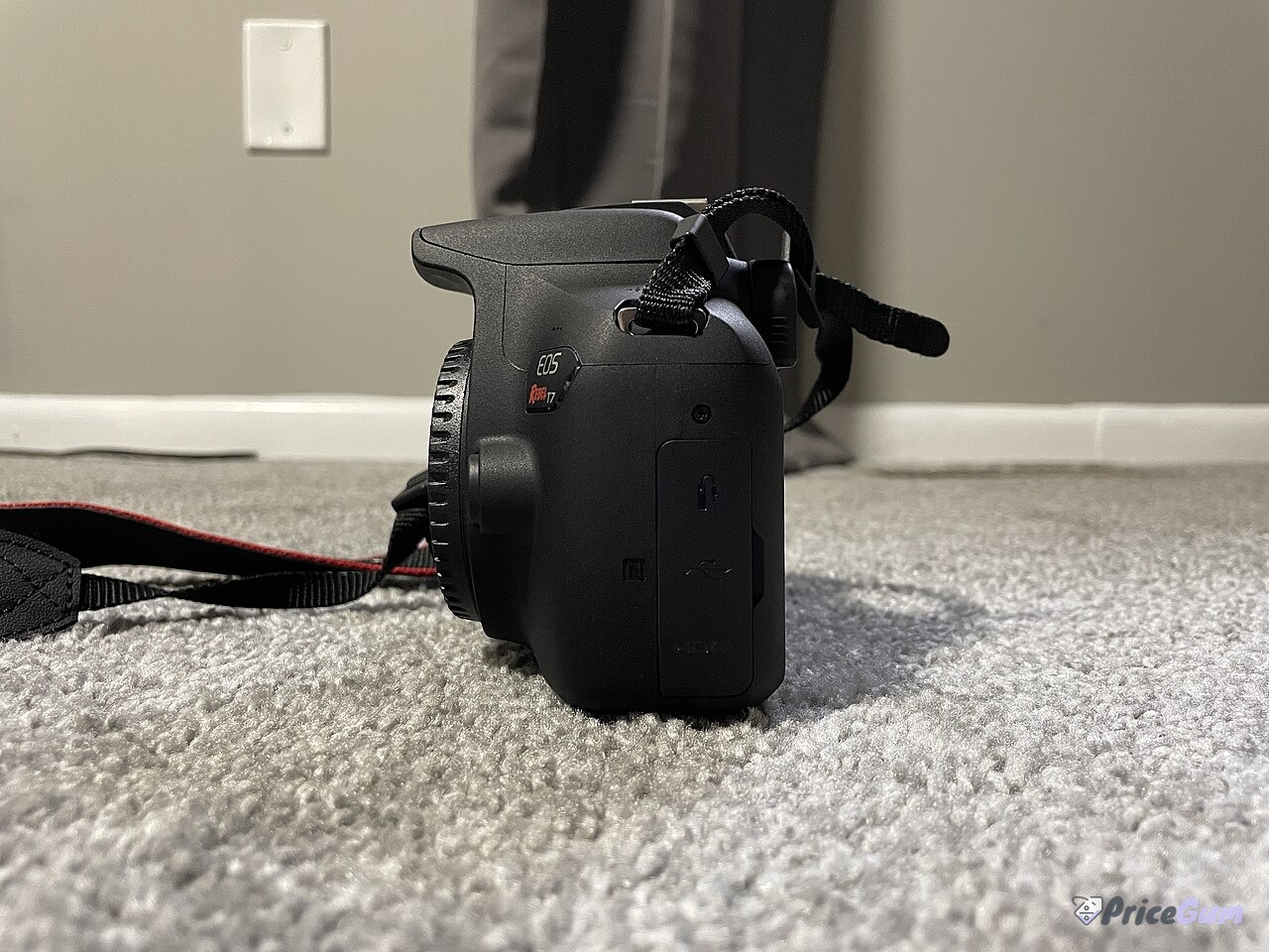 Canon EOS 2000D side view showing ports and grip