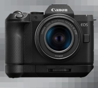 Canon EOS R8 Mark II front view with RF 24-50mm kit lens and extension grip