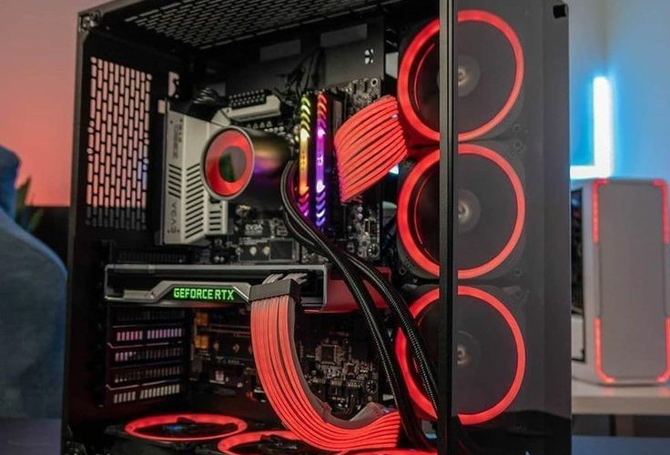 Mid-tower gaming PC build with RGB fans and tempered glass side panel