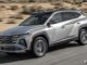 Hyundai Tucson Hybrid front three quarter view in silver