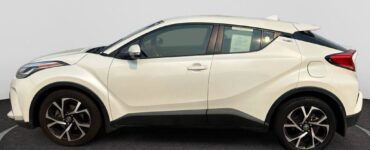 Toyota C-HR white compact crossover side view