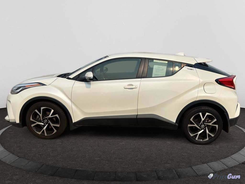 Toyota C-HR white compact crossover side view